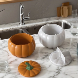 Pumpkin shaped resin silicone mold set for DIY storage jars on marble background