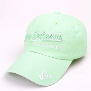 Detail of mint green washed cotton baseball cap with New Orleans jazz embroidery