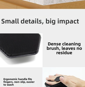 Detail of ergonomic black silicone body brush with dense bristles and non-slip handle