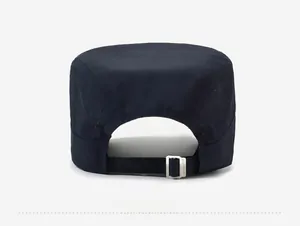 Detail of navy sport flat top cap back with laser-cut vents and metal buckle