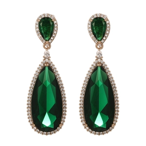 Detailed view of emerald green teardrop earrings with pave-set crystals in gold plating