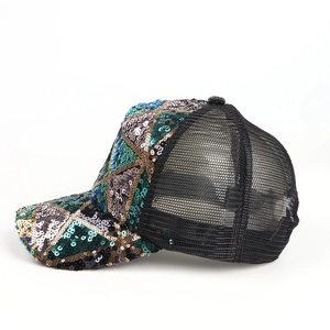 Detail of colorful sequins and breathable black mesh on a stylish baseball cap