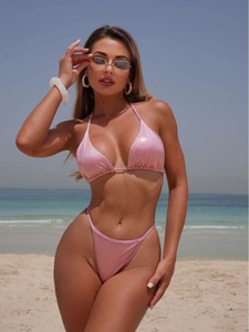 Pink shimmering two-piece bikini set for women featuring halter top and high cut bottoms
