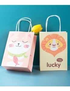 Detailed view of cartoon lion and cat printed white kraft paper gift bags with handles