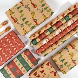 Christmas kraft wrapping paper roll with reindeer and tree patterns and jute rope