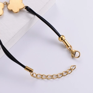 18k gold plated plum flower bracelet with black woven rope and adjustable chain