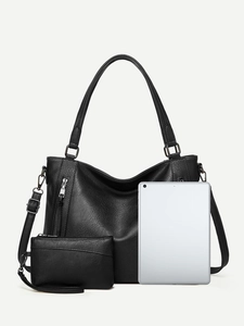 Detail of black pebbled faux leather tote and pouch set with tablet for size comparison