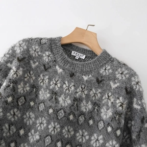 Women's chunky knit sweater featuring grey snowflake jacquard and textured mohair finish