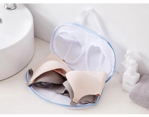 Breathable mesh laundry bag for bras showing internal protective frame for machine washing