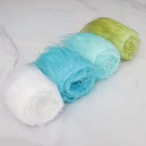 Detail of colorful long-pile faux fur ribbons in white, sky blue, cyan and light green
