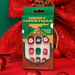 Christmas themed soft gel press-on nails set with red and green festive patterns