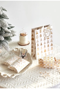 Christmas gift packaging set featuring gold foil tree bags and star-shaped candy boxes