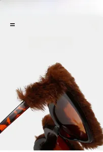 Detail of plush brown fur trim on heart sunglasses with classic tortoise temple