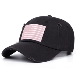Stylish black distressed baseball cap with pink American flag embroidery detail.
