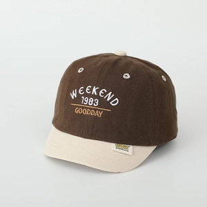 Close-up of weekend embroidery on color-block cotton baseball cap for kids