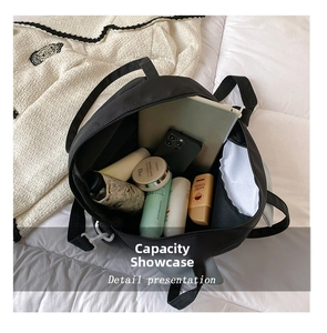 Detail presentation showing the spacious interior of the black large capacity cat tote bag