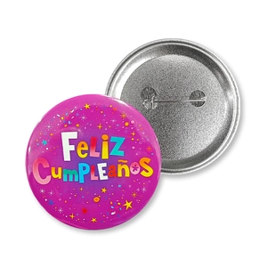 Tinplate birthday badge detail showing the vibrant purple front and metal pin back