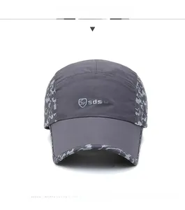Front detail of dark grey quick-dry baseball cap with camo trim and side ventilation holes