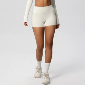 Detail of high-waist seamless yoga shorts with squat-proof fabric in ivory white color