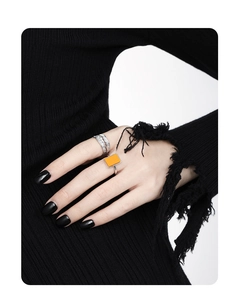 Close-up of S925 sterling silver square orange turquoise ring and hollow band on fingers