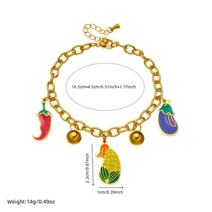 Golden chain bracelet with enamel vegetable pendants including chili, corn, and eggplant