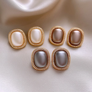 French vintage oval pearl earrings with zircon inlay in cream, brown and grey tones