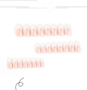 Detail view of 24pcs long coffin press on nails featuring nude pink base and white French tips