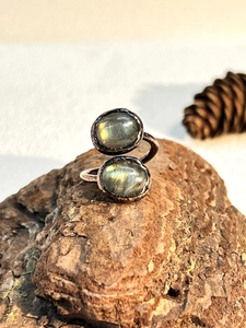 Detailed macro view of retro textured ring with dual iridescent oval labradorite stones