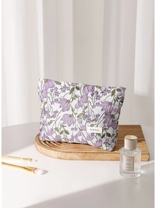 Floral canvas makeup bag with purple flower embroidery on wave wooden tray