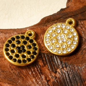 Minimalist 304 stainless steel gold pendants with black and white rhinestones on wood