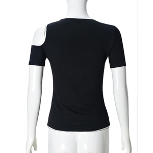 Close-up of black slim-fit top featuring white contrast edging and back shoulder cut-out
