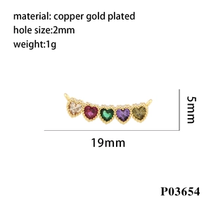 Macro view of 19mm gold-plated connector with heart-shaped colorful cubic zirconia stones