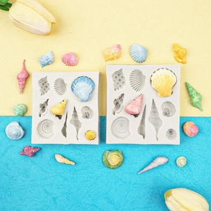 Silicone shell molds for baking and crafts with colorful seashell-shaped fondant