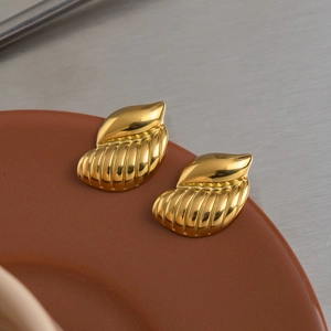 Polished gold snail-shaped fan stud earrings with striped texture in stainless steel