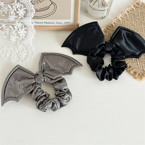 Halloween bat wing scrunchies in black satin and silver metallic fabric for women
