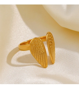 Macro detail of 18K gold plated wing ring on silk background with adjustable opening