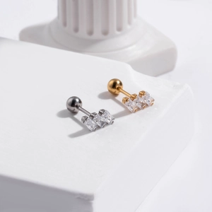 Pair of stainless steel cartilage studs with vertical triple zircon in gold and silver