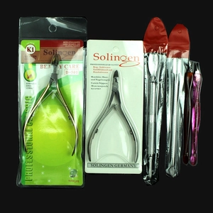 Close-up of D-501 professional stainless steel cuticle nippers and manicure tool set