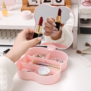 Pink flower-shaped jewelry organizer box with makeup mirror and divided compartments