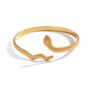 Minimalist gold snake-shaped open bangle with textured scales in stainless steel