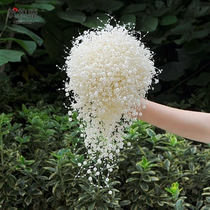 Detailed cascading bridal bouquet with white imitation pearls and flowing handmade tassels