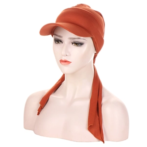 Caramel headwrap hat with visor and long adjustable straps shown on a white mannequin head