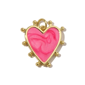 Detail showing pink textured heart pendant with golden beaded frame for DIY jewelry