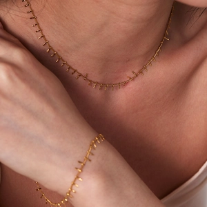 Elegant 18K gold plated stainless steel necklace and bracelet set with delicate tassels