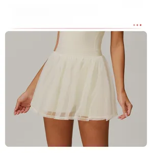 Detailed view of cream ruffled skort with breathable mesh layer and inner shorts