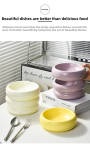 Close-up of matte ceramic bubble bowls in purple, yellow and cream for home dining