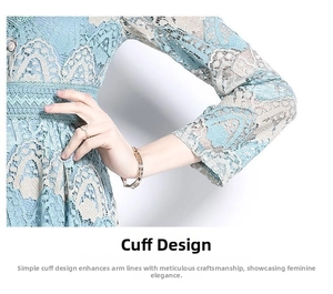 Close-up of elegant light blue lace embroidery on dress cuffs and forearm details
