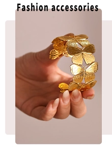 Detailed view of 18k gold butterfly cuff bracelet with intricate embossed wing textures