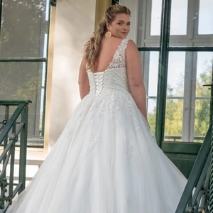 Elegant plus size white lace V-neck wedding dress with corset back and full tulle skirt