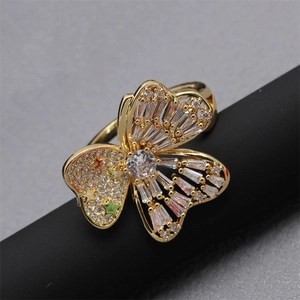 Adjustable golden butterfly ring with sparkling cubic zirconia and colorful star accents